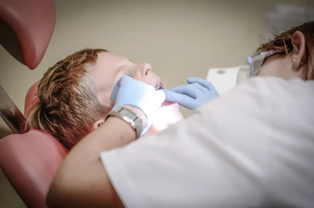 Child being examined by the dentist.